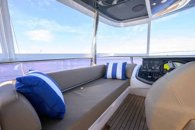 Janie II Yacht Photos Pics Luxurious interior of 2021 Princess Y78 yacht with plush seating and ocean view.