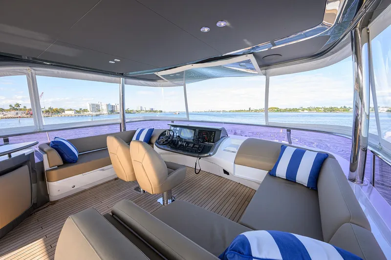 Janie II Yacht Photos Pics Luxurious 2021 Princess Y78 yacht interior with plush seating and scenic ocean view.