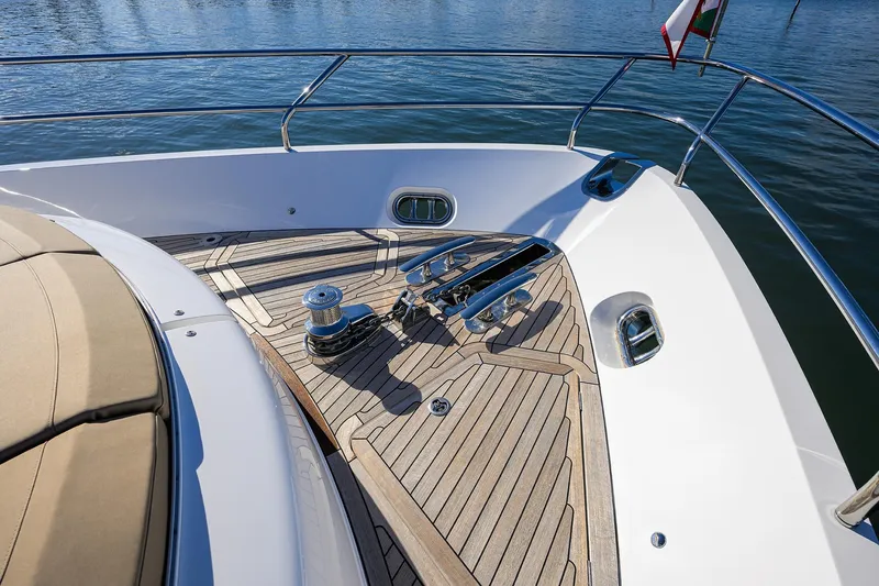 Janie II Yacht Photos Pics Bow deck of 2021 Princess Y78 yacht with teak flooring and stainless steel fittings.