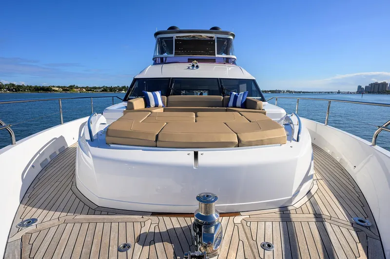 Janie II Yacht Photos Pics Luxurious 2021 Princess Y78 yacht with spacious deck and sunbathing area on open water.