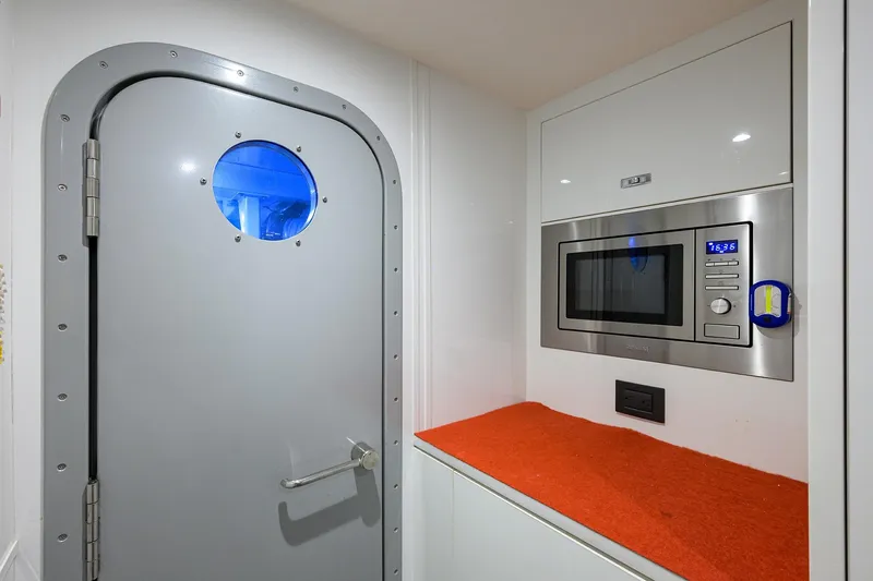 Janie II Yacht Photos Pics Modern yacht interior with microwave and porthole door, Princess Y78, 2021 model.