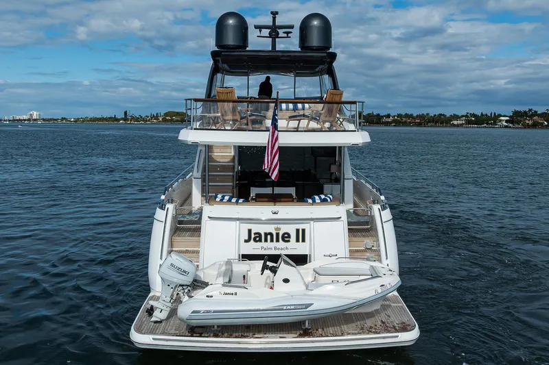 Janie II Yacht Photos Pics Luxury Princess Y78 yacht, 2021 model, cruising with tender boat and American flag.