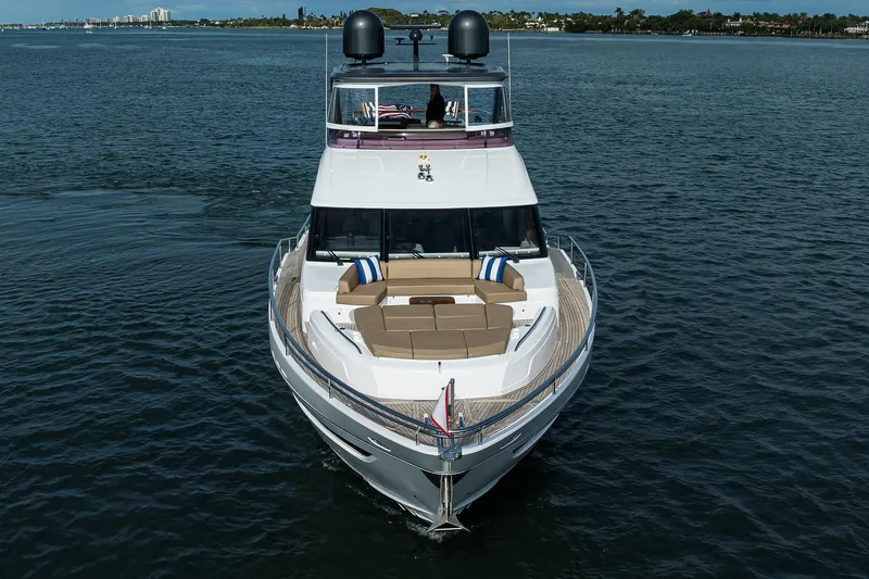 Janie II Yacht Photos Pics Luxury 2021 Princess Y78 yacht cruising on open water, featuring elegant design and spacious deck.