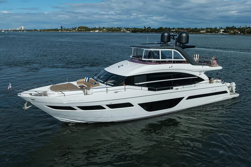 Janie II Yacht Photos Pics Luxury 2021 Princess Y78 yacht cruising on open water under a cloudy sky.