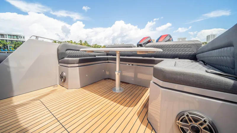 Skipper 38 Twin Mercury 400 V10 Verado Yacht Photos Pics Luxurious 2025 Skipper-BSK 38 yacht deck with cushioned seating and wooden flooring.