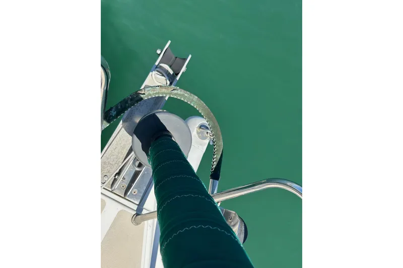 Ma Jolie Yacht Photos Pics Bow of 1996 J Boats J/120 sailboat with green water backdrop.