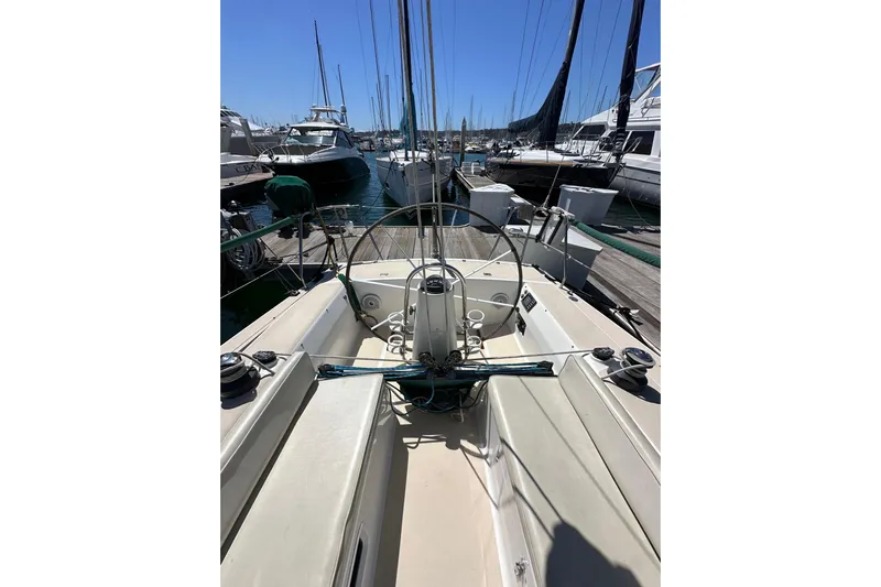 Ma Jolie Yacht Photos Pics 1996 J Boats J/120 sailboat cockpit view in marina, surrounded by other boats.