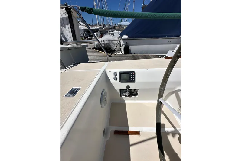 Ma Jolie Yacht Photos Pics 1996 J Boats J/120 cockpit with steering wheel and control panel at marina.