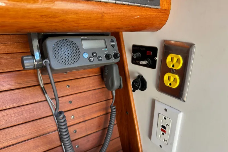 Ma Jolie Yacht Photos Pics VHF radio and electrical outlets on 1996 J Boats J/120 yacht interior.