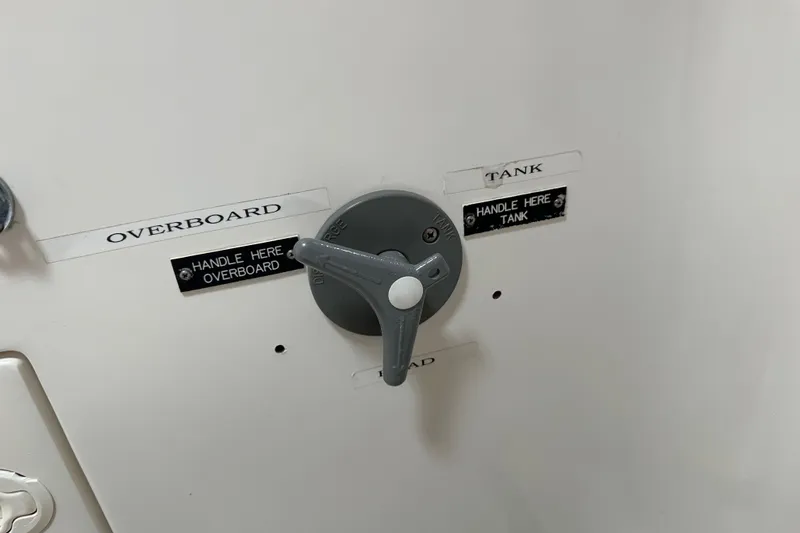 Ma Jolie Yacht Photos Pics Control valve on 1996 J Boats J/120, labeled for overboard and tank discharge.