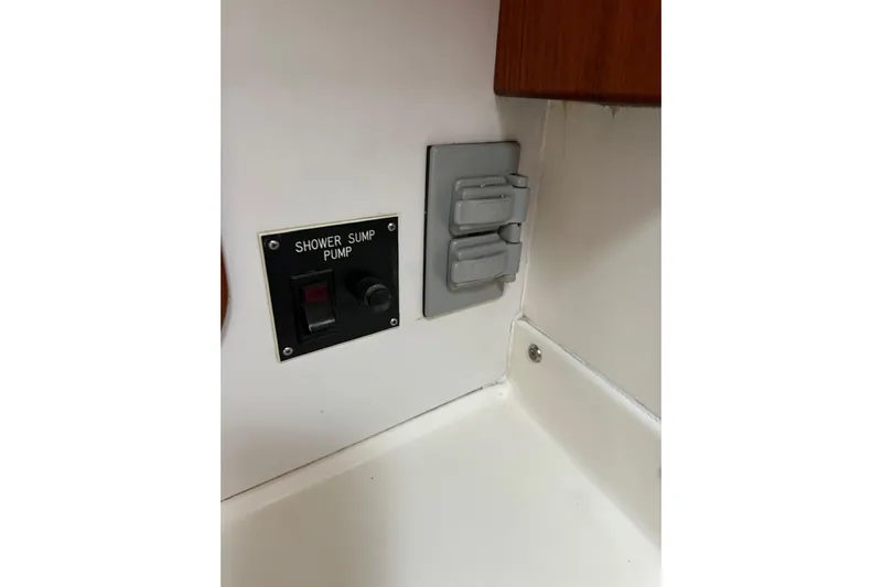 Ma Jolie Yacht Photos Pics Shower sump pump switch on 1996 J Boats J/120 yacht interior.
