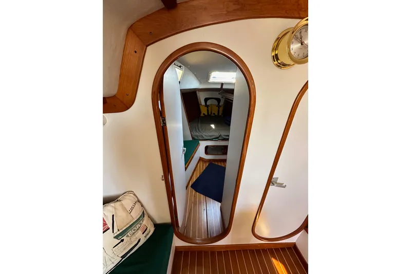 Ma Jolie Yacht Photos Pics Interior of 1996 J Boats J/120 sailboat with wooden accents and cozy cabin.