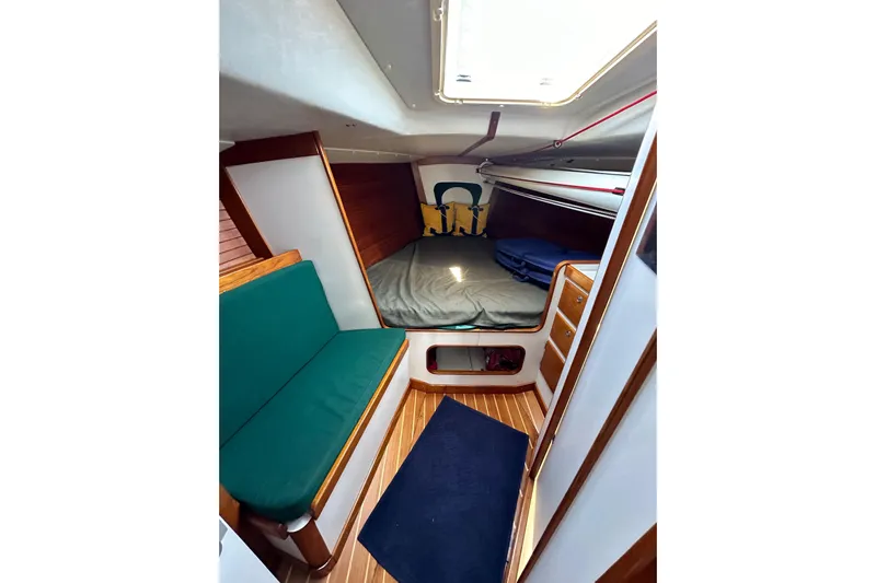 Ma Jolie Yacht Photos Pics Interior of 1996 J Boats J/120 sailboat with cozy cabin and wooden accents.