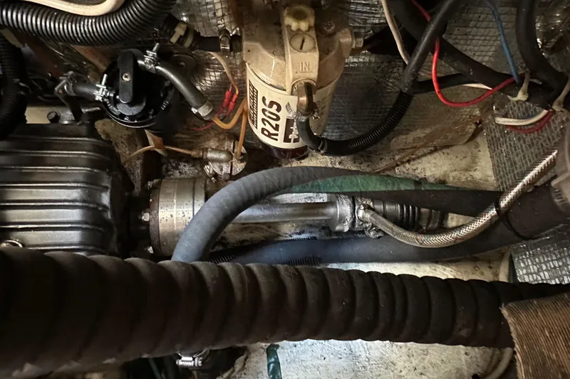 Ma Jolie Yacht Photos Pics Engine compartment of a 1996 J Boats J/120, showcasing mechanical components and wiring.