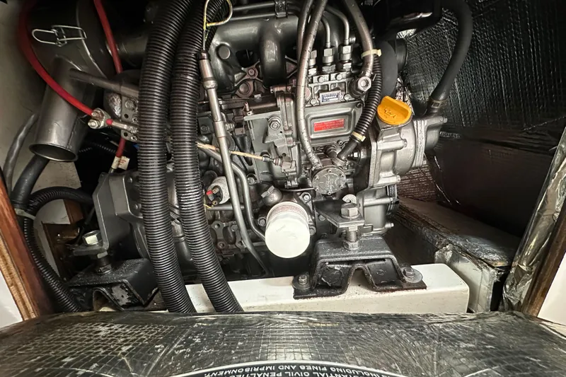 Ma Jolie Yacht Photos Pics Engine compartment of a 1996 J Boats J/120 sailboat, showcasing detailed mechanical components.