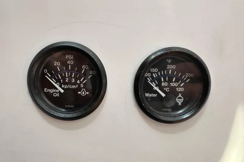 Ma Jolie Yacht Photos Pics Engine oil and water temperature gauges on a 1996 J Boats J/120 yacht.