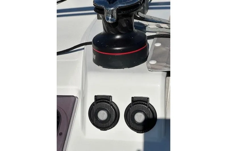 Knotaulis Yacht Photos Pics Close-up of 2023 Beneteau Oceanis 34.1 yacht deck winch and controls.