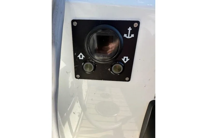 Knotaulis Yacht Photos Pics Control panel on 2023 Beneteau Oceanis 34.1 sailboat, featuring anchor symbols and buttons.