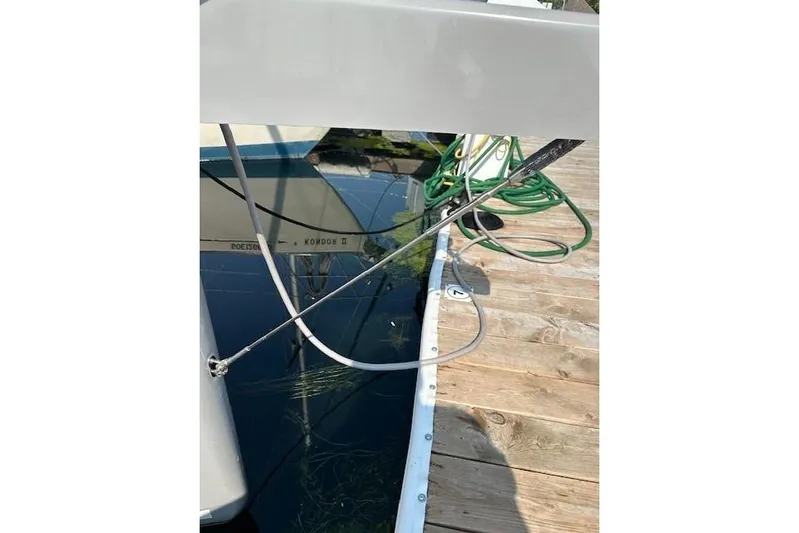 Knotaulis Yacht Photos Pics 2023 Beneteau Oceanis 34.1 sailboat docked with visible rigging and deck.