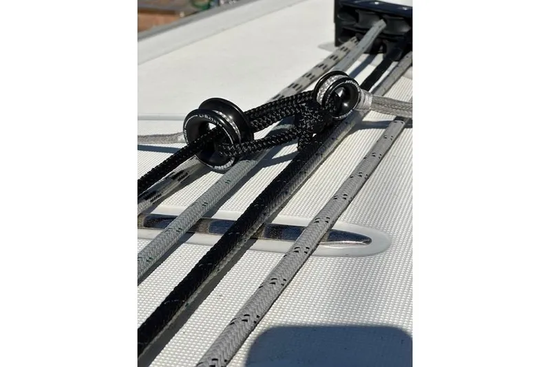 Knotaulis Yacht Photos Pics Close-up of rigging on a 2023 Beneteau Oceanis 34.1 sailboat deck.