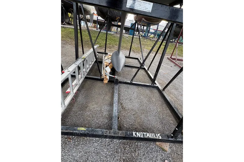 Knotaulis Yacht Photos Pics 2023 Beneteau Oceanis 34.1 sailboat keel on metal cradle in boatyard.