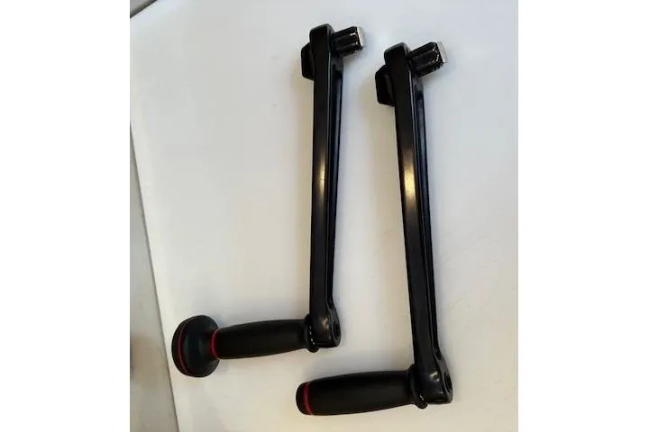 Knotaulis Yacht Photos Pics Two black winch handles for 2023 Beneteau Oceanis 34.1 sailboat.