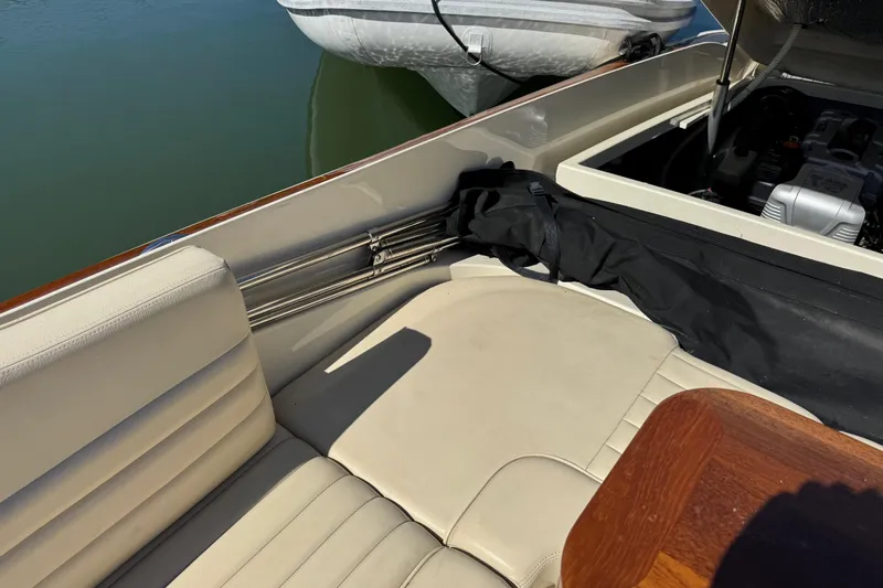  Yacht Photos Pics 2015 Chris-Craft Corsair 32 interior with beige seating and engine compartment.
