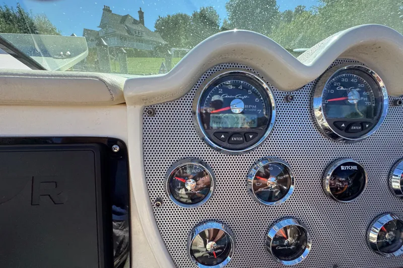  Yacht Photos Pics Dashboard of a 2015 Chris-Craft Corsair 32 boat with gauges and controls.