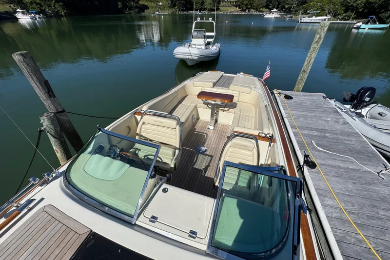  Yacht Photos Pics 2015 Chris-Craft Corsair 32 docked, showcasing elegant interior and classic design.