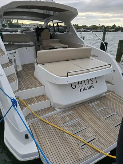 Ghost Yacht Photos Pics 2018 Azimut Atlantis 43 yacht with teak deck, docked by the water.
