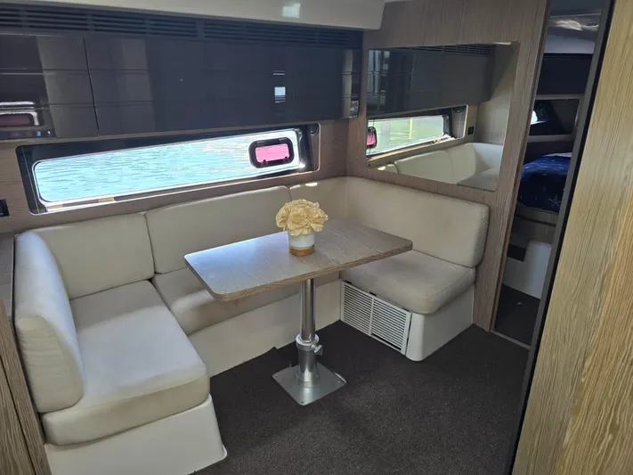 Ghost Yacht Photos Pics Interior of 2018 Azimut Atlantis 43 yacht with cozy seating and table.
