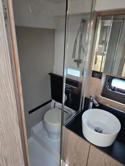 Ghost Yacht Photos Pics Bathroom interior of 2018 Azimut Atlantis 43 yacht, featuring modern fixtures and sleek design.