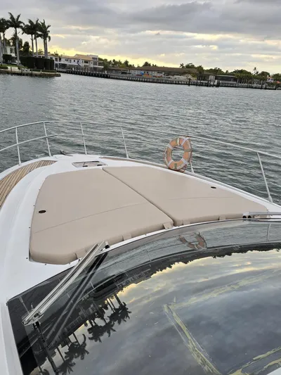 Ghost Yacht Photos Pics 2018 Azimut Atlantis 43 yacht on calm waters, featuring spacious deck and scenic view.