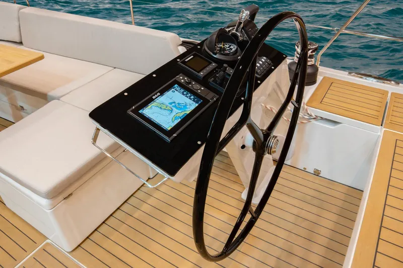  Yacht Photos Pics 2025 Hanse 510 yacht cockpit with modern navigation system and sleek steering wheel.