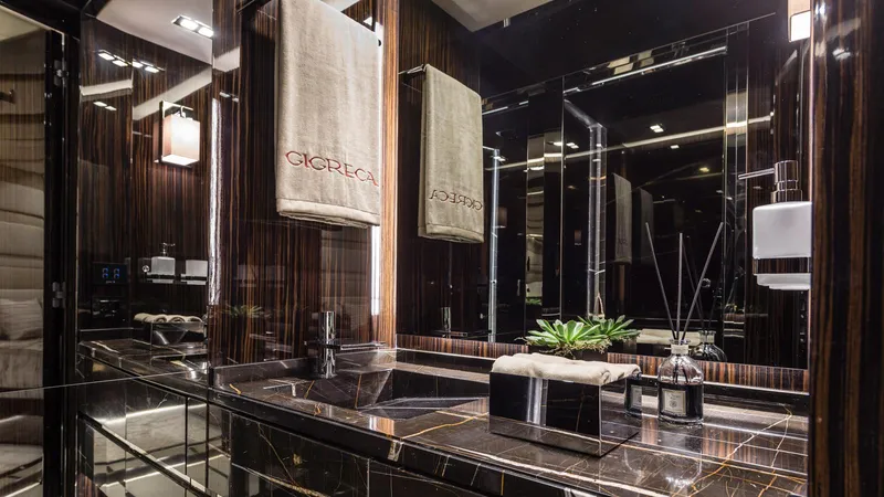  Yacht Photos Pics Luxurious yacht bathroom with elegant dark marble and modern fixtures, Admiral Silent 76, 2014.