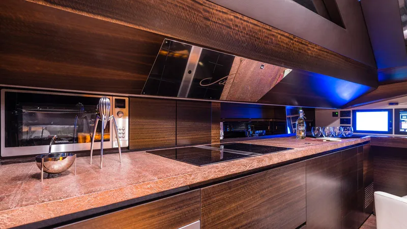  Yacht Photos Pics Luxurious kitchen interior of 2014 Admiral Silent 76 yacht with modern appliances and sleek design.