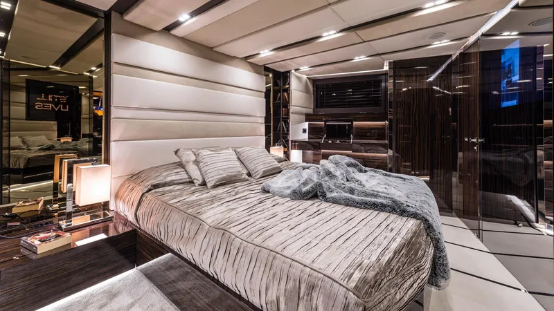  Yacht Photos Pics Luxurious bedroom interior on 2014 Admiral Silent 76 yacht, featuring elegant design and modern amenities.