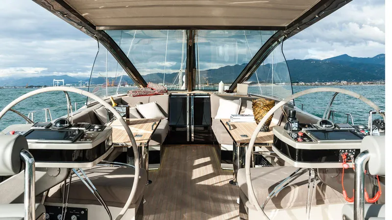  Yacht Photos Pics Luxurious Admiral Silent 76 yacht interior, 2014 model, with elegant seating and scenic ocean view.