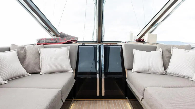  Yacht Photos Pics Luxurious interior of 2014 Admiral Silent 76 yacht with plush seating and cushions.