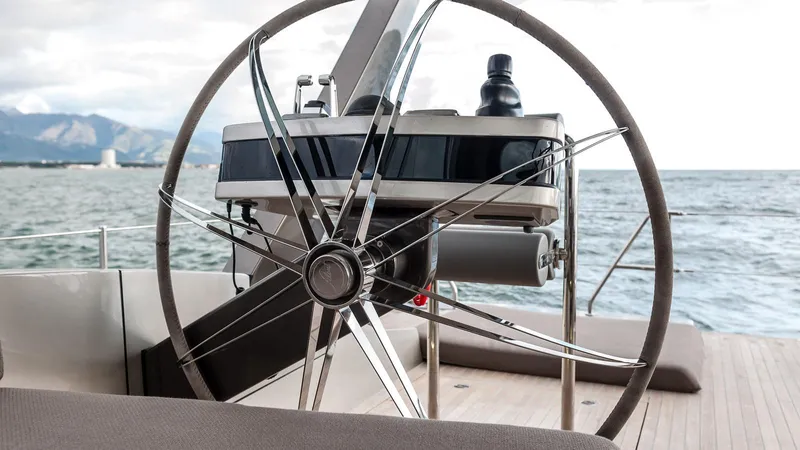  Yacht Photos Pics Steering wheel of 2014 Admiral Silent 76 yacht on open sea.