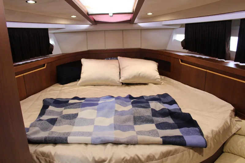  Yacht Photos Pics Luxurious cabin interior of 2017 Galeon 385 HTS yacht with cozy bedding.