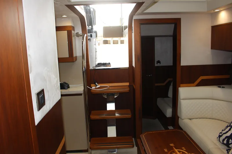  Yacht Photos Pics Interior of 2017 Galeon 385 HTS yacht, featuring elegant wood finishes and modern design.