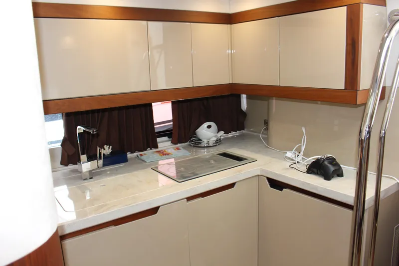  Yacht Photos Pics Modern kitchen interior of 2017 Galeon 385 HTS yacht with sleek cabinetry and appliances.