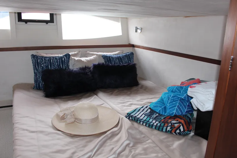  Yacht Photos Pics Cozy cabin interior of 2017 Galeon 385 HTS yacht with stylish bedding and decor.