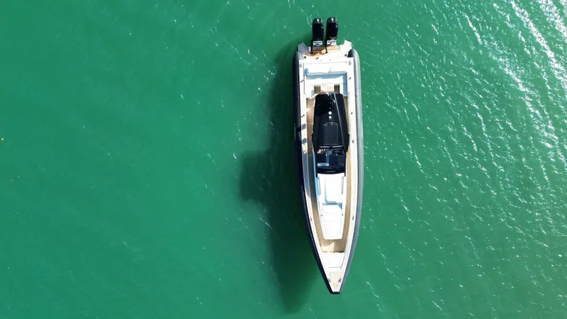  Yacht Photos Pics Aerial view of 2023 Technohull 47 Omega on turquoise water.