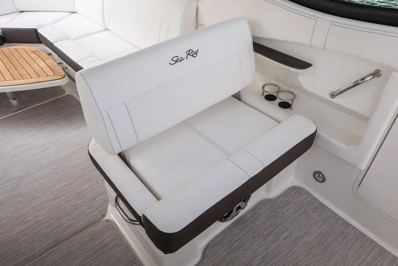  Yacht Photos Pics Luxurious seating on 2025 Sea Ray Sundancer 320 yacht with elegant design and cup holders.