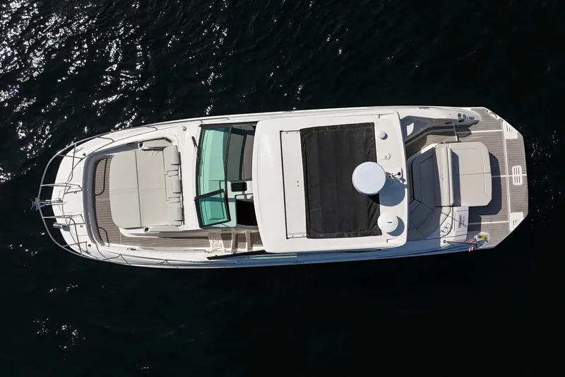  Yacht Photos Pics Aerial view of 2025 Sea Ray Sundancer 320 yacht on dark water.