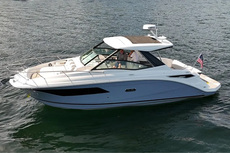  Yacht Photos Pics 2025 Sea Ray Sundancer 320 cruising on water, featuring sleek design and modern amenities.