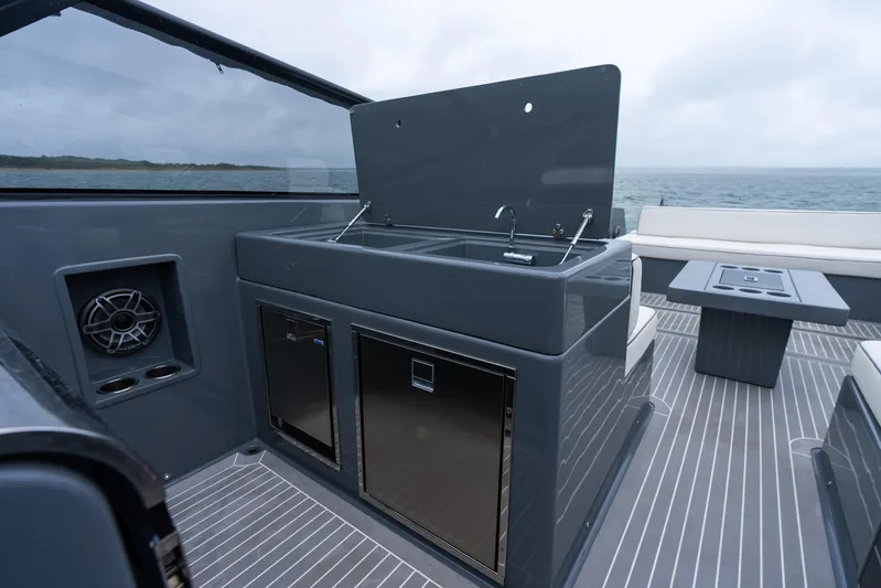 Brix Yacht Photos Pics Luxury VanDutch 48 yacht interior with sleek kitchen area, ocean view, and modern design.