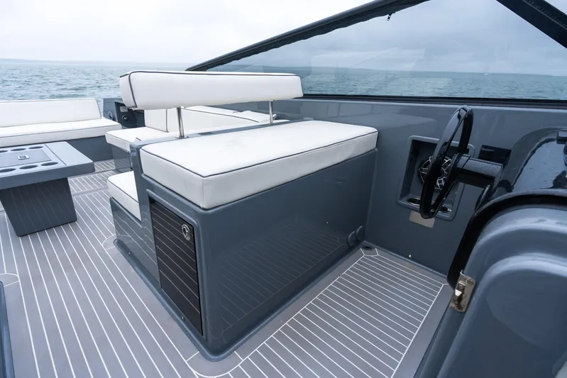 Brix Yacht Photos Pics 2023 VanDutch 48 yacht interior with sleek seating and modern steering wheel design.